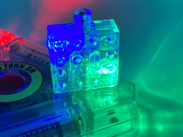 LASER PEGS: Electronic Brick 4 x 4 x 1 1/3 with Pegs Opposite with Blue/Green Lights - trans-clear