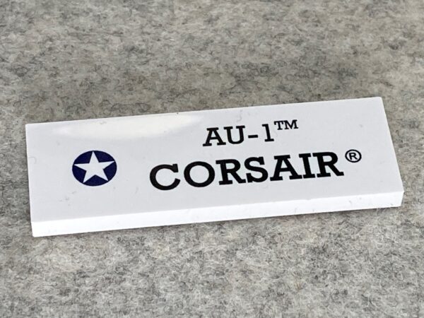 COBI: Pad printed Tile 2 x 6 Black "AU-1™ CORSAIR®" - white (bialy)